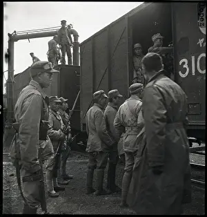 Manchuria Prints: Communist Troops Put Aboard Train