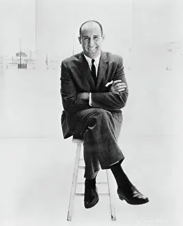 Composer Henry Mancini Sitting on Stool