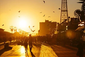 Images Dated 12th October 2015: Coney Island Boardwalk at sunset, Brooklyn, NYC