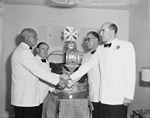 Coronation Prints: Conrad Hilton and Ambassadors with Crown Cake