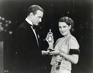 Conrad Nagel Presents Oscar to Norma Shearer