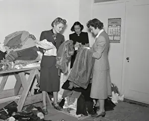 Constance Bennett, Dolores Del Rio and Claudette Colbert Inspecting Clothing