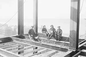 Prints of (Original Caption). Photo shows Peter Horn, John Tarbell, Jack Hill, and Joe La Claire, Iroquois Indians, as they appear enjoying their noonday lunch, high above the gleaming Hudson River Daredevil Construction Worker Prints: Construction Workers Enjoying Lunch