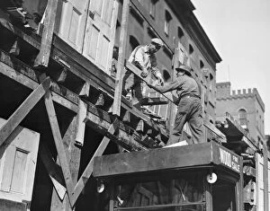 Construction workers on scaffolding