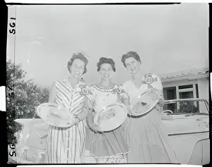 Contestant Winners Holding Their Trophies
