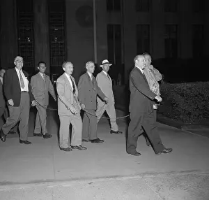 Convicted Communists Walk from Court