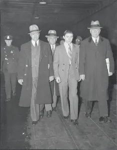 Surrender Prints: Convicted Suspect James Sullivan Being Transported by Detectives