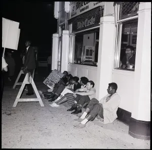 Core Prints: CORE Demonstrators Sit Outside Restaurant