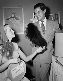 Designer Prints: Costumer Presents Hats To Rita Hayworth
