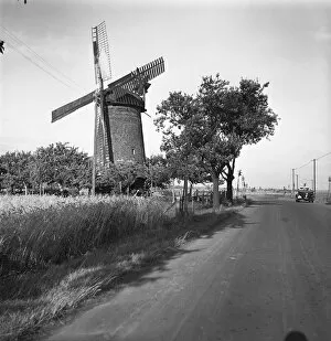 Country road and traditional windmill