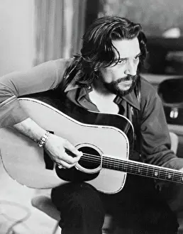 Country Singer Waylon Jennings Playing Acoustic Guitar