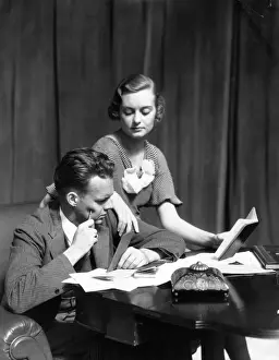 Couple At A Desk With Check Books Papers Balance Books & Inkwell The Woman Wearing A