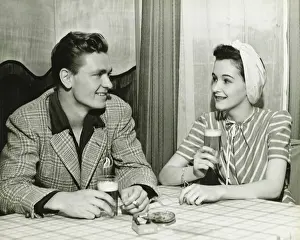 Dating Prints: Couple drinking beer at bar table, (B&W)