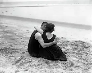 Hugging Prints: Couple embracing on beach