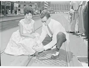 Couple Frying Eggs on Trolley Tracks
