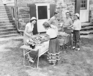 Couple Giving a Backyard Barbecue for Friends