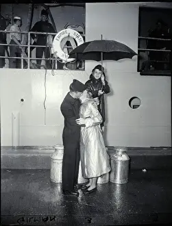Cadet Prints: Couple Kiss Goodbye As Boy Holds Umbrell