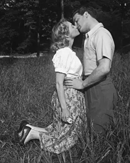 Couple kissing outdoors