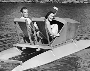 Couple on lake in paddle boat