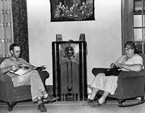 Legs Crossed Prints: Couple Listening to Radio