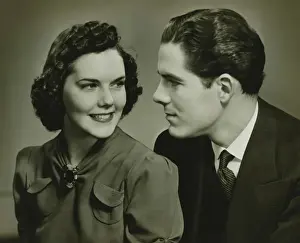 Mid Adult Couple Prints: Couple looking in eyes, posing in studio, (B&W), portrait