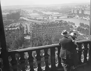 Couple Looking at Paris From the Eiffel Tower