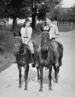 30 35 Years Prints: Couple riding horses (B&W)