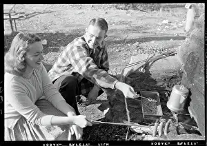 Camping Prints: Couple Roasting Hot Dogs on Flame Stove