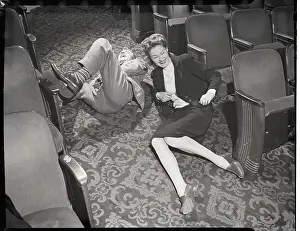 Rolling Prints: Couple Rolling in Aisle of Theater