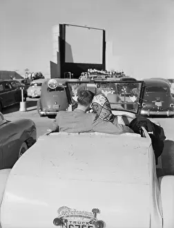 Couple Seated in Car at Drive-In