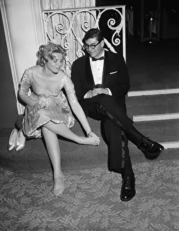 Couple Seated with Girl Rubbing Feet