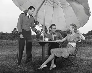 Couple being served by waiter