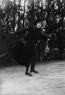 Ice Rink Prints: Couple Smile as They Figure Skate