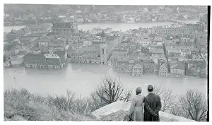 Couple Standing on Hill and Gazing at Damaged Landscape