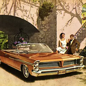 Couple Standing Next to Orange Convertible Car