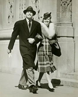 Arm In Arm Gallery: Couple walking arm in arm in street