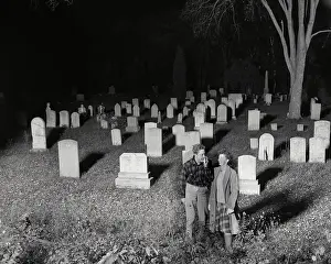 Eerie Prints: Couple Walking in Graveyard at Night
