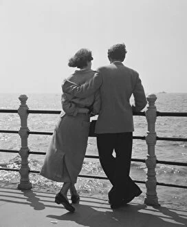 Images Dated 8th April 2010: Couple Watching The Sea on Blackpool Promenade
