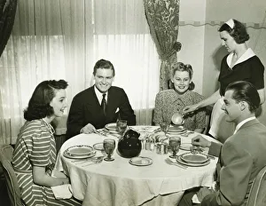 35 39 Years Collection: Two couples having dinner, maid pouring soup, (B&W)