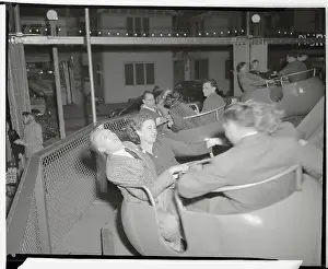 Couples Riding Amusement Park Ride