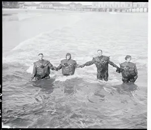 Couples Standing in the Ocean