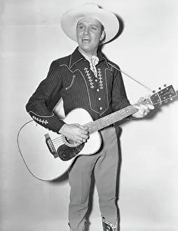 Cowboy Gene Autry Playing Guitar and Singing