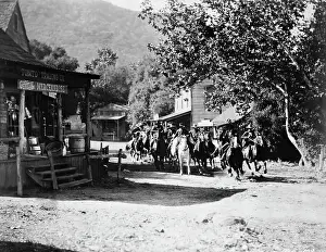 Westerns Prints: Cowboys Riding Through Street