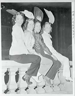 Cowgirls Sitting on Banister