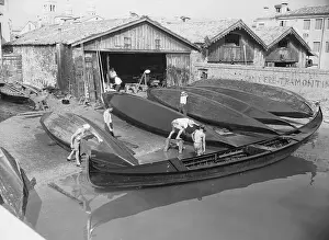 Craftsmen Finishing Gondolas Outside