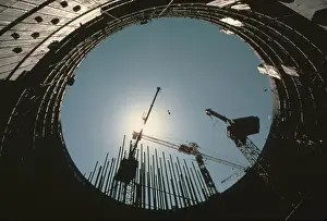 Building Construction Prints: Cranes Silhouetted By Mid-Day Sun
