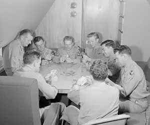 Crew of the Douglas Playing Poker on President's Conference Table