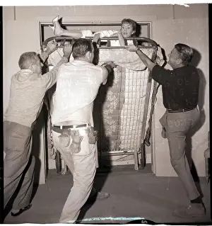 Folding Prints: Crew Helps Debbie Reynolds out of Folding Bed