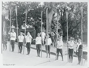 Crew Members Holding Oars