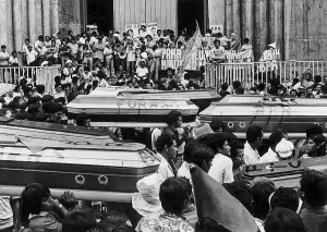 Graffiti Prints: Crowd Carrying Coffins Through Street